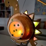 Make a DIY dinosaur lantern out of paper plates