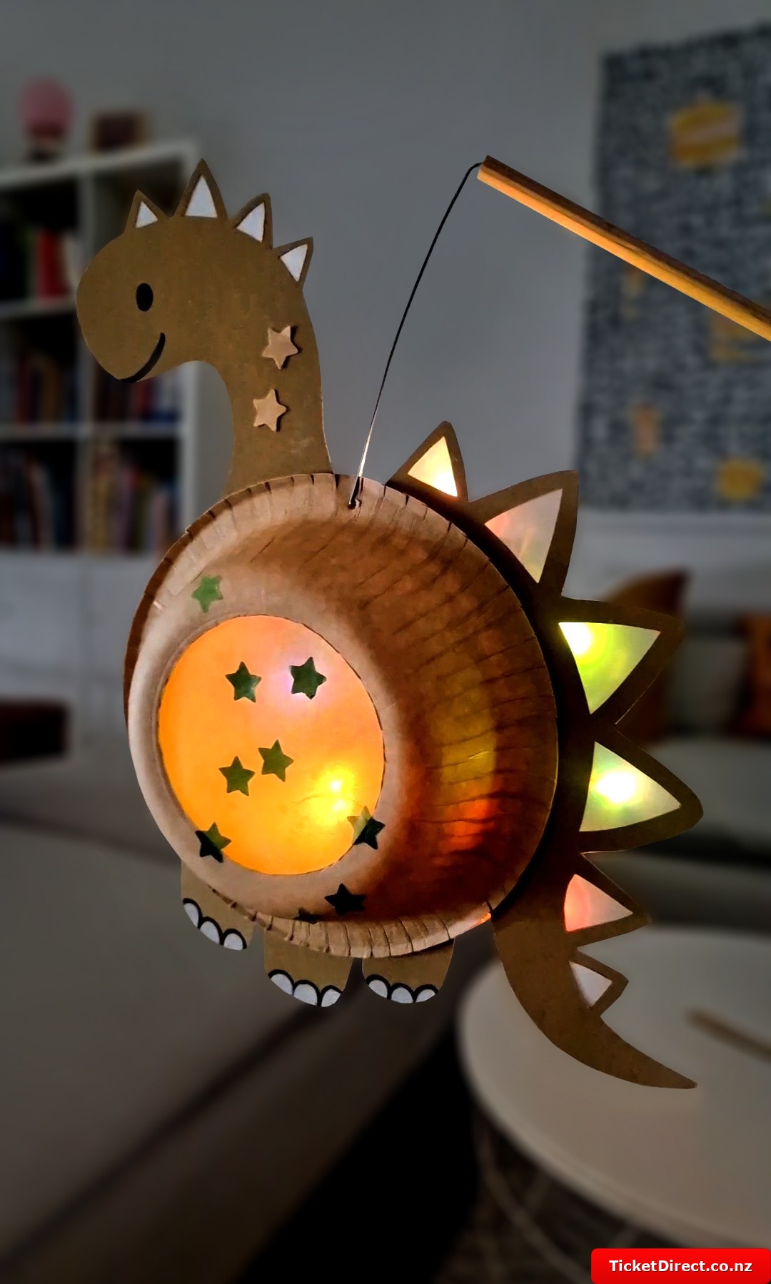 Make a DIY dinosaur lantern out of paper plates